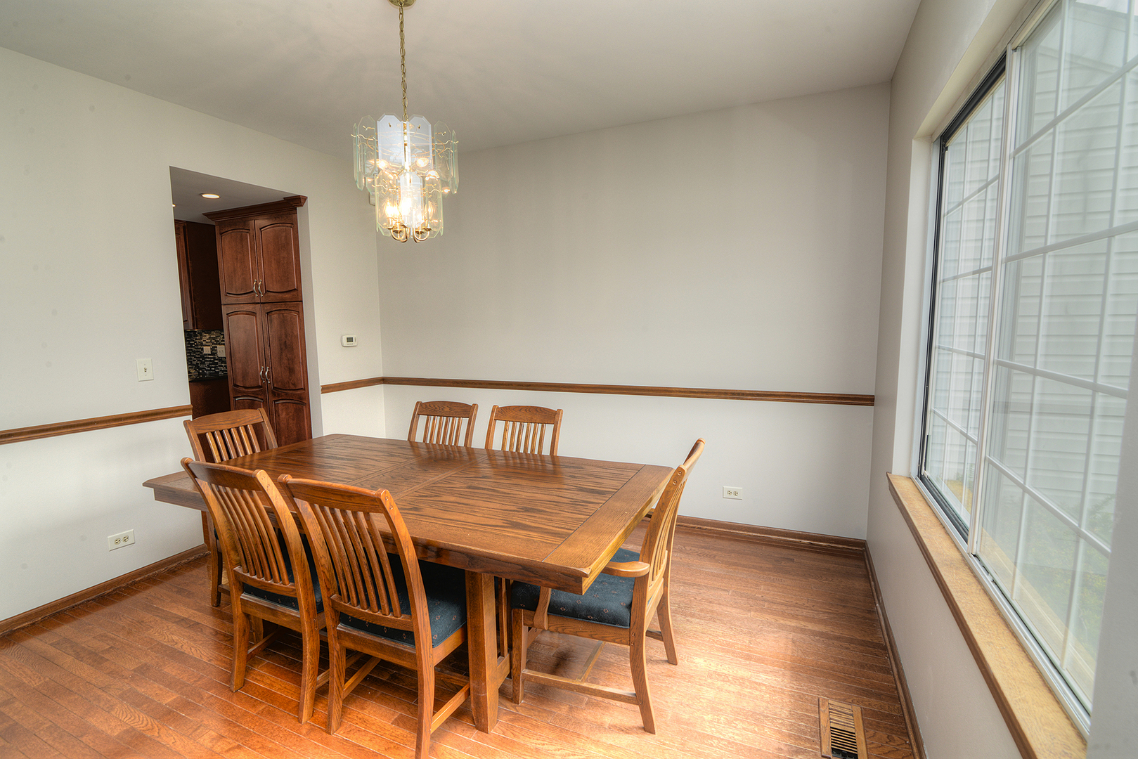 503 Yardley Drive Carol Stream, IL 60188 - Photo 5 of 41 a view of a dining room with furniture wooden floor and a chandelier