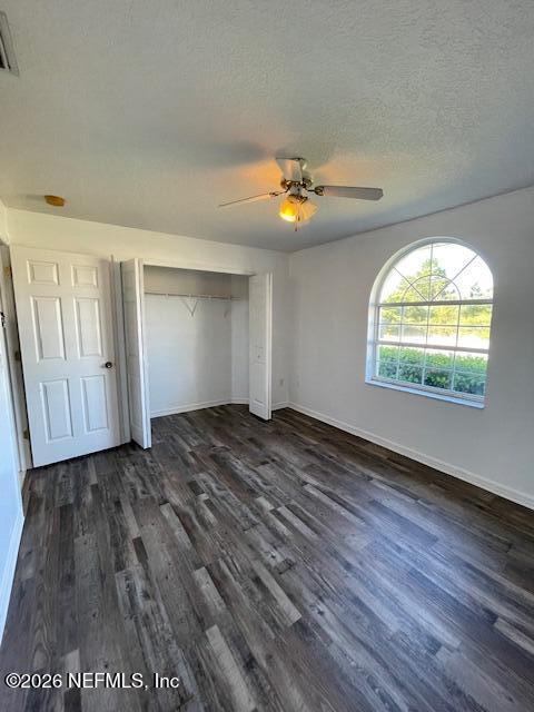 9 Lyons Place Palm Coast, FL 32137 - Photo 18 of 31 an empty room with wooden floor and a window