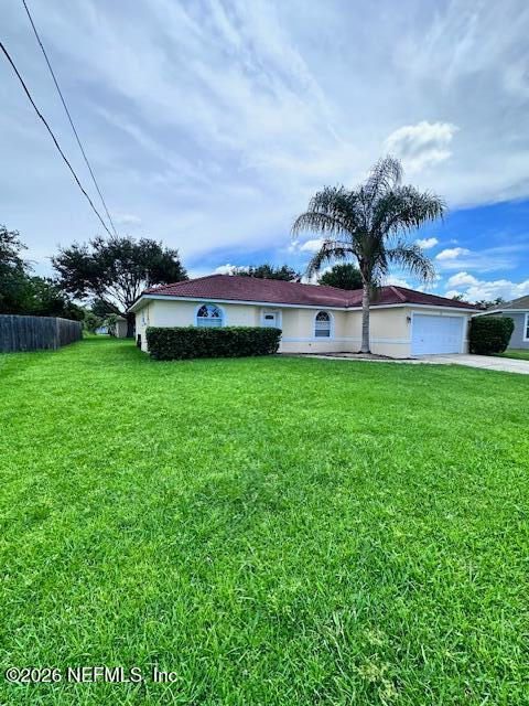9 Lyons Place Palm Coast, FL 32137 - Photo 2 of 31 a view of a garden