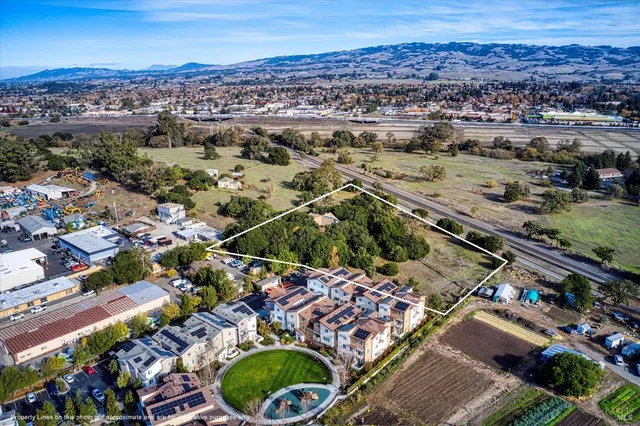 an aerial view of residential houses and outdoor space