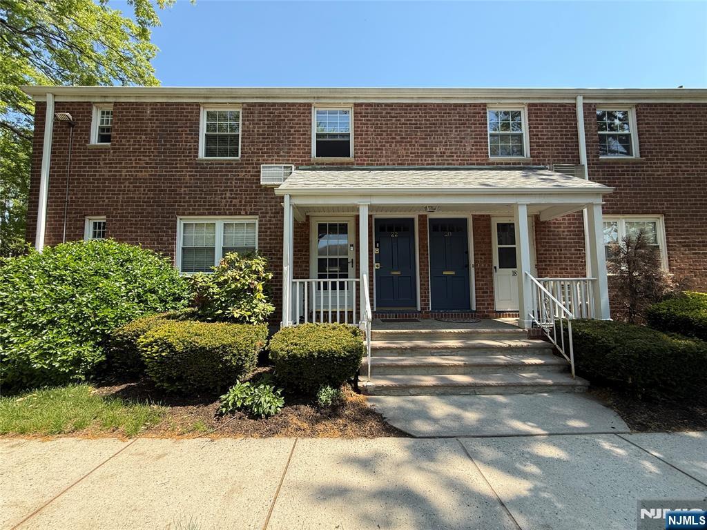 20 Clark Court Rutherford, NJ 07070 - Photo 2 of 29 a front view of a house with a garden