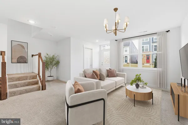 a living room with furniture a chandelier and a chandelier