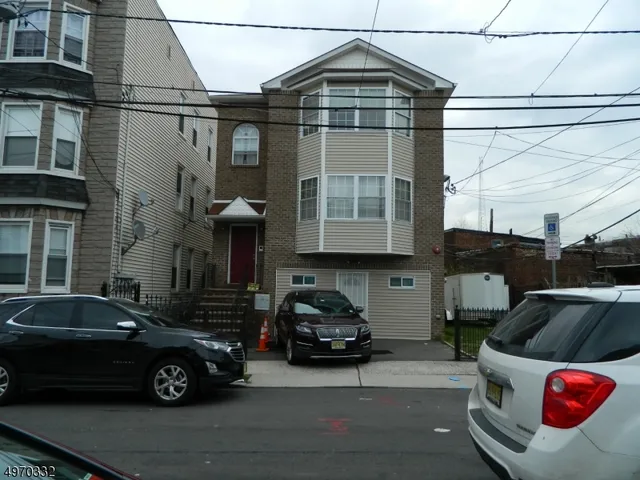 a car parked in front of a house