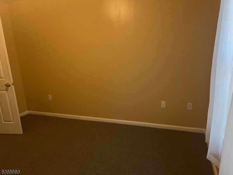 45 2nd Street Newark, NJ 07107 - Photo 30 of 32 an empty room with a door