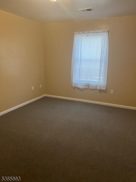 45 2nd Street Newark, NJ 07107 - Photo 31 of 32 an empty room with a window