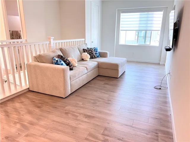 a bedroom with a bed and a black tv