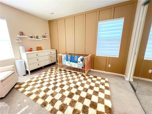 a bedroom with windows