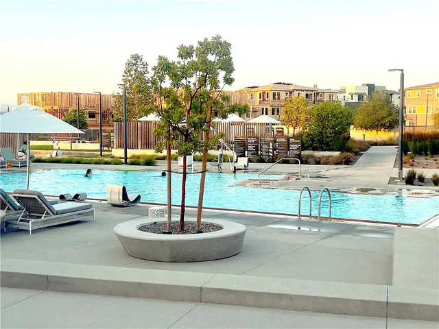 a view of yard with patio and swimming pool