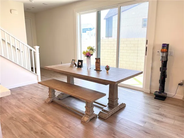 a dining room with table and chairs