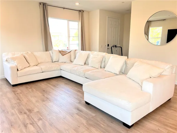 a living room with furniture and a large window