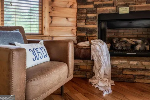 a kitchen with stainless steel appliances kitchen island granite countertop a refrigerator and a sink