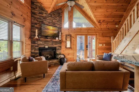 a kitchen with granite countertop a sink a window and cabinets