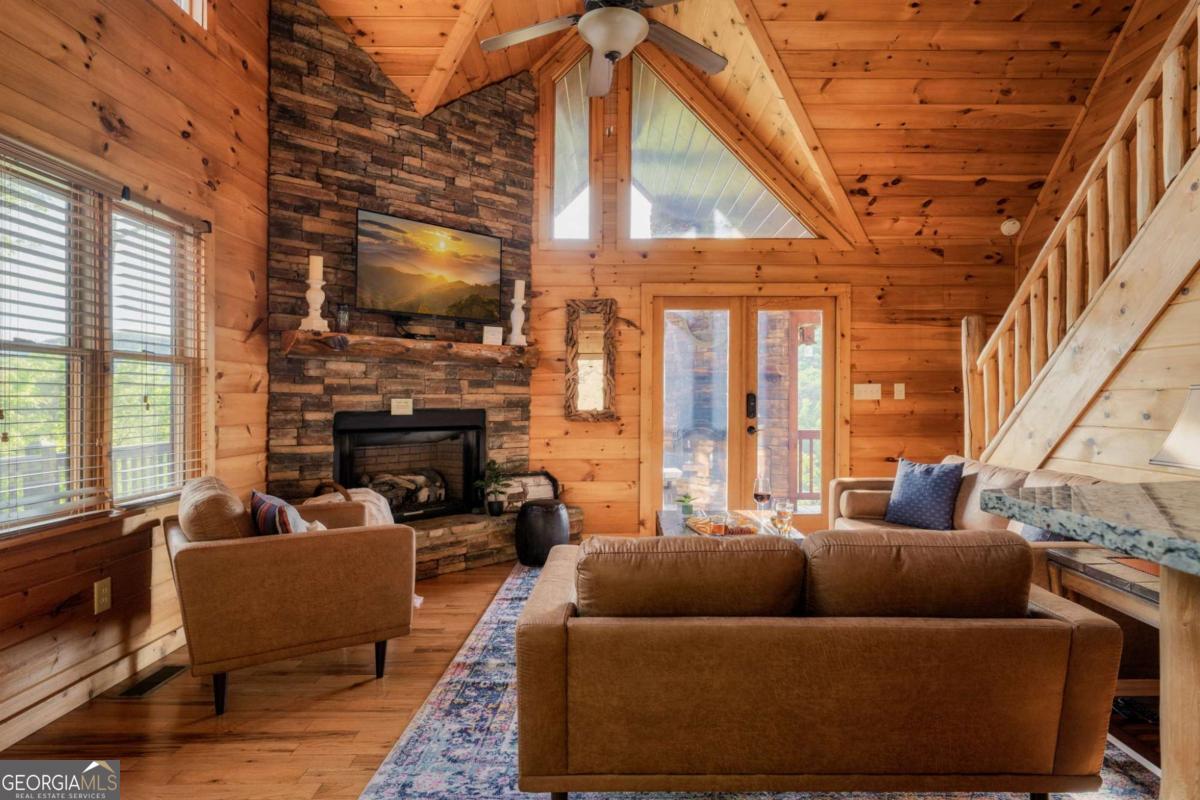 273 Deer Crest Heights Blue Ridge, GA 30513 - Photo 17 of 73 a living room with furniture and a flat screen tv