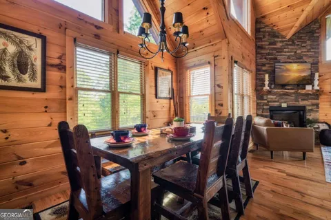 a view of a balcony dining table and chairs