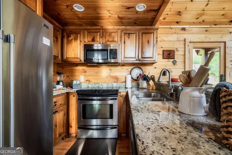a view of a chair and tables in the balcony