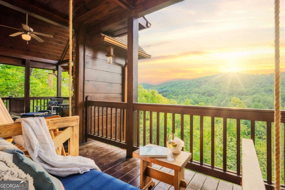 273 Deer Crest Heights Blue Ridge, GA 30513 - Photo 32 of 73 a view of a chair and tables in the balcony