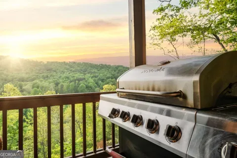 a bathroom with a granite countertop sink a mirror and shower