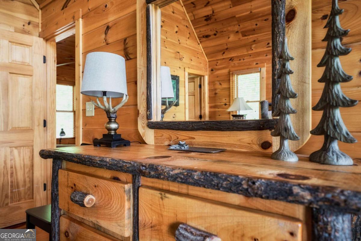 273 Deer Crest Heights Blue Ridge, GA 30513 - Photo 45 of 73 a bathroom with a granite countertop sink and a mirror