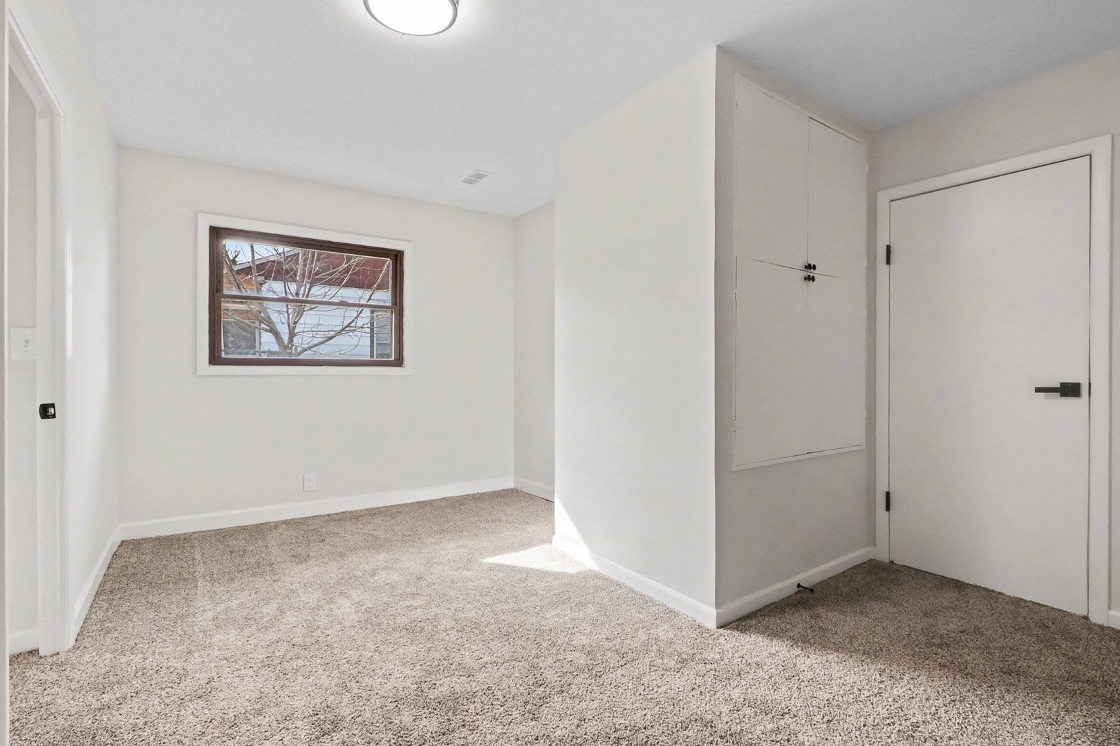 629 Thornton Street Lockport, IL 60441 - Photo 11 of 15 an empty room with a view of a livingroom