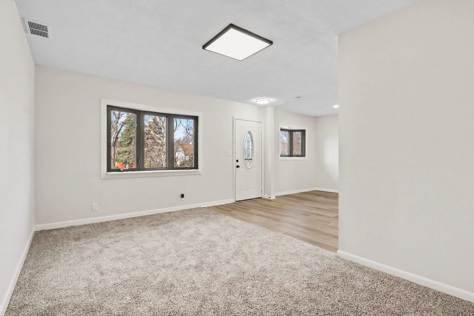 629 Thornton Street Lockport, IL 60441 - Photo 2 of 15 an empty room with windows