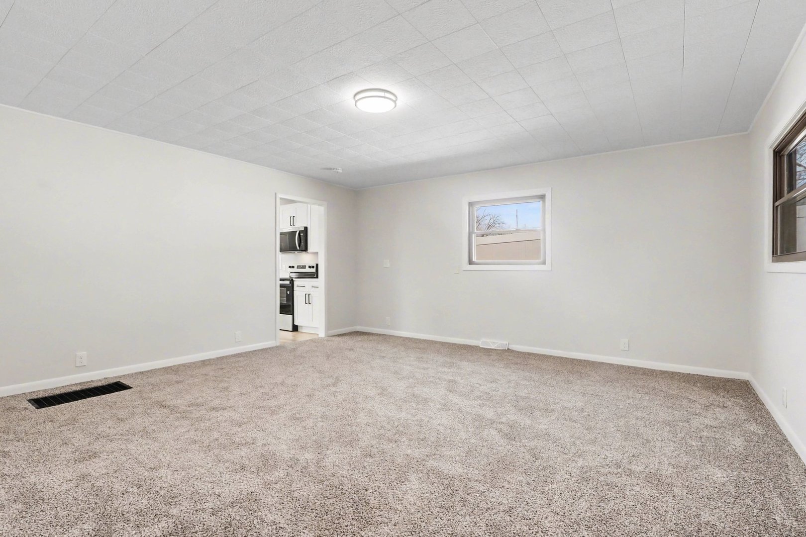 629 Thornton Street Lockport, IL 60441 - Photo 4 of 15 an empty room with a window