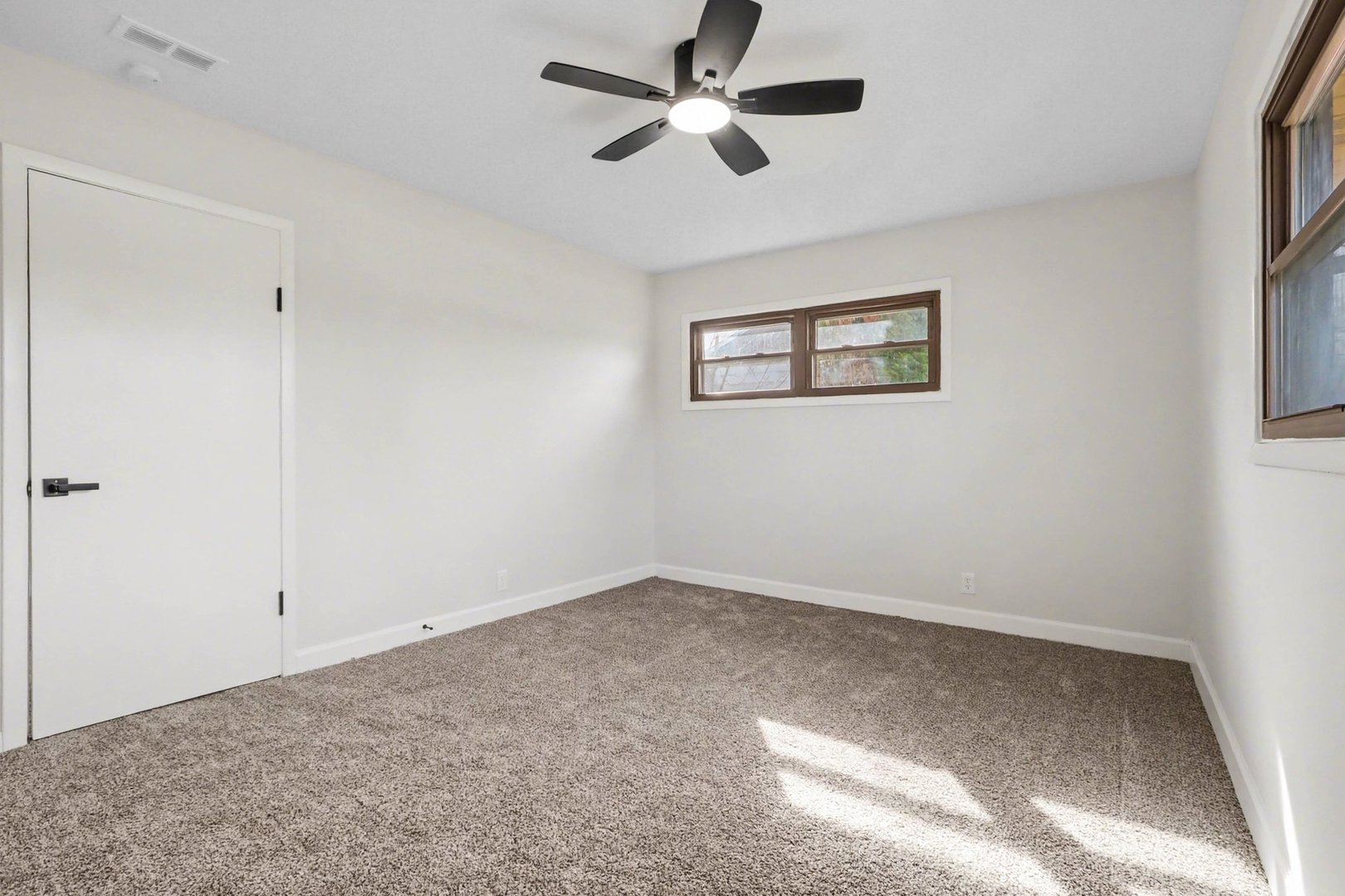 629 Thornton Street Lockport, IL 60441 - Photo 10 of 15 wooden floor in an empty room with a window