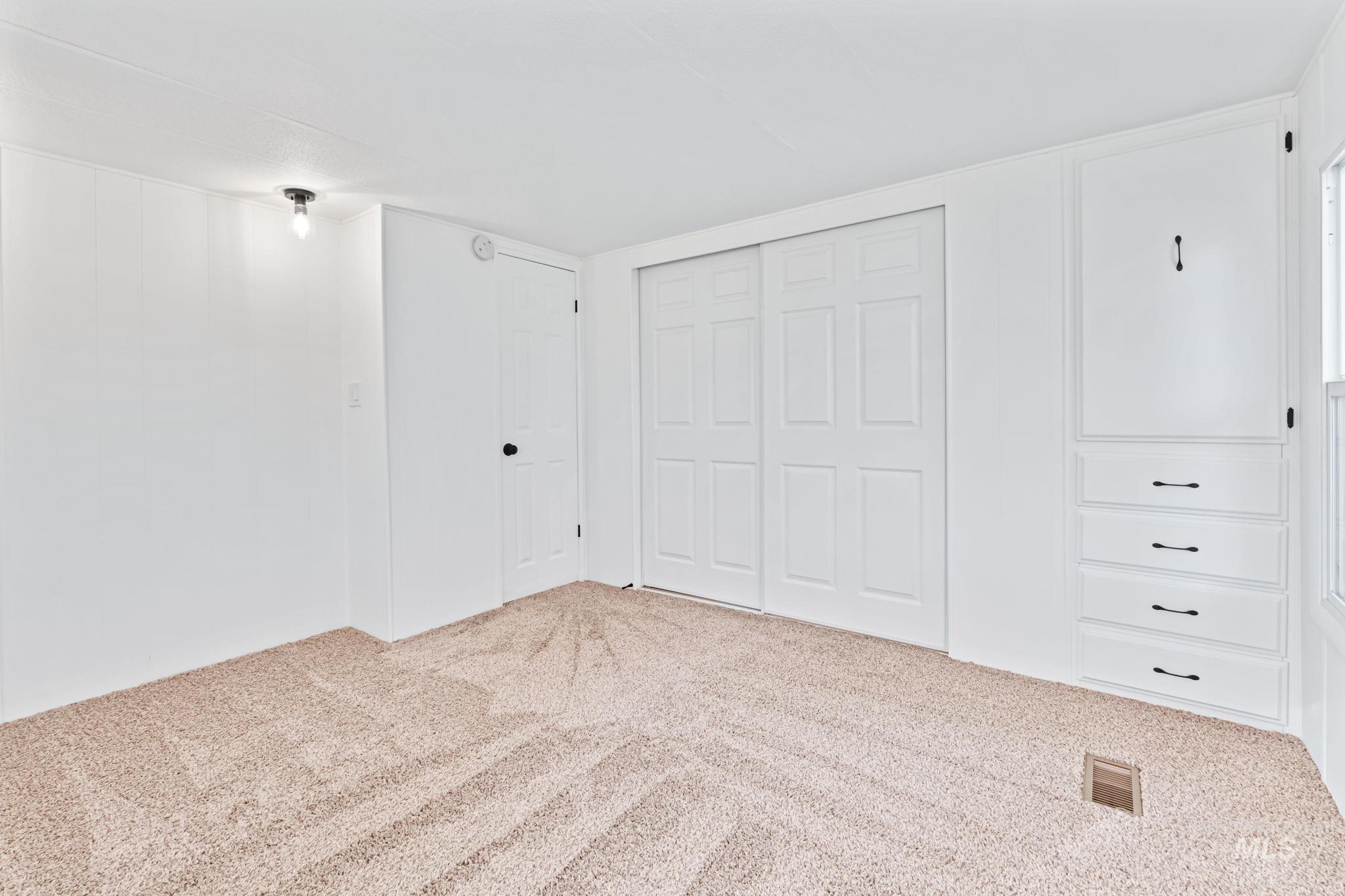 358 Bonanza Street Boise, ID 83713 - Photo 22 of 25 Unfurnished bedroom with a closet and carpet flooring