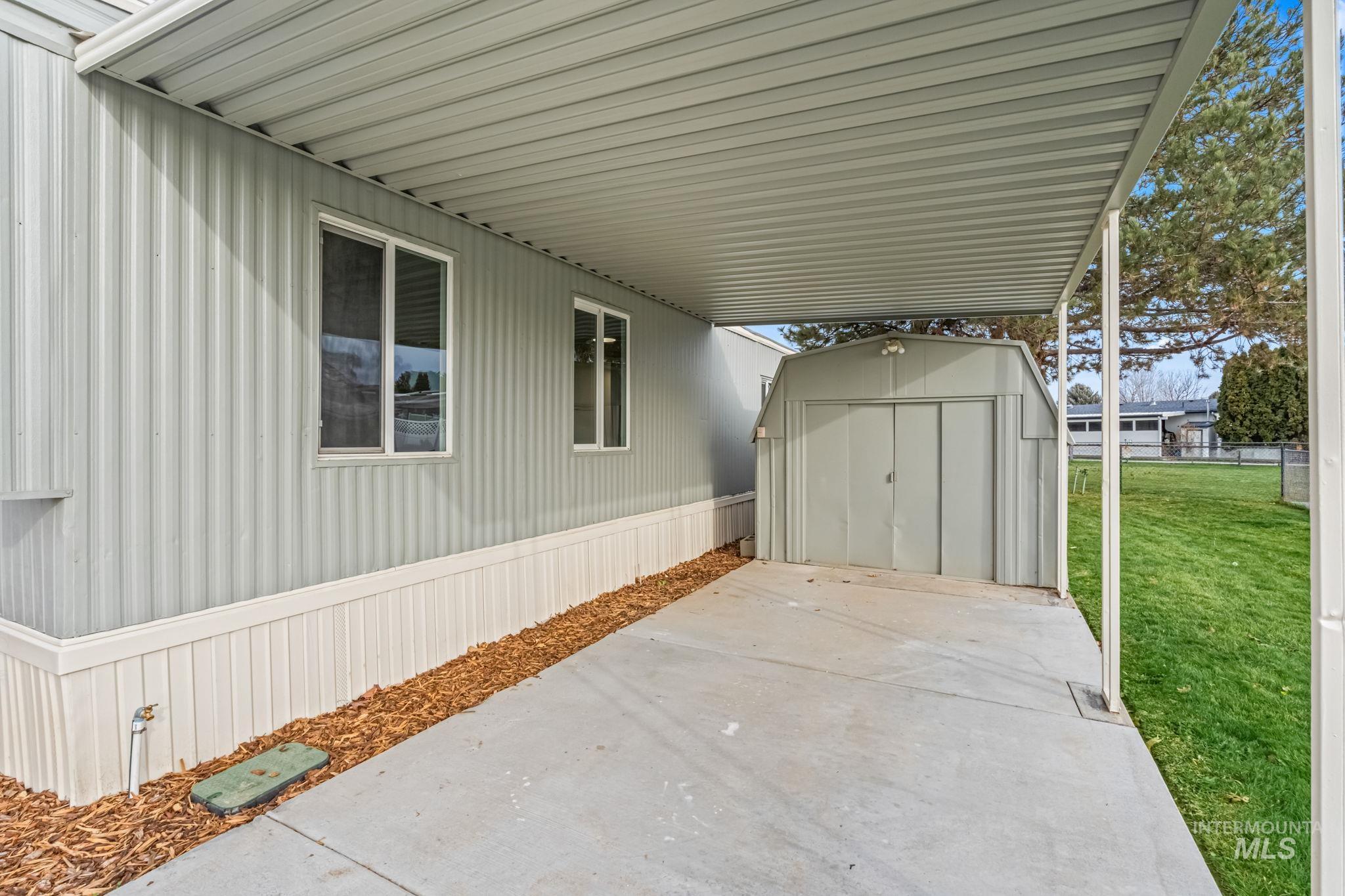 358 Bonanza Street Boise, ID 83713 - Photo 3 of 25 View of patio / terrace with a storage unit and a carport