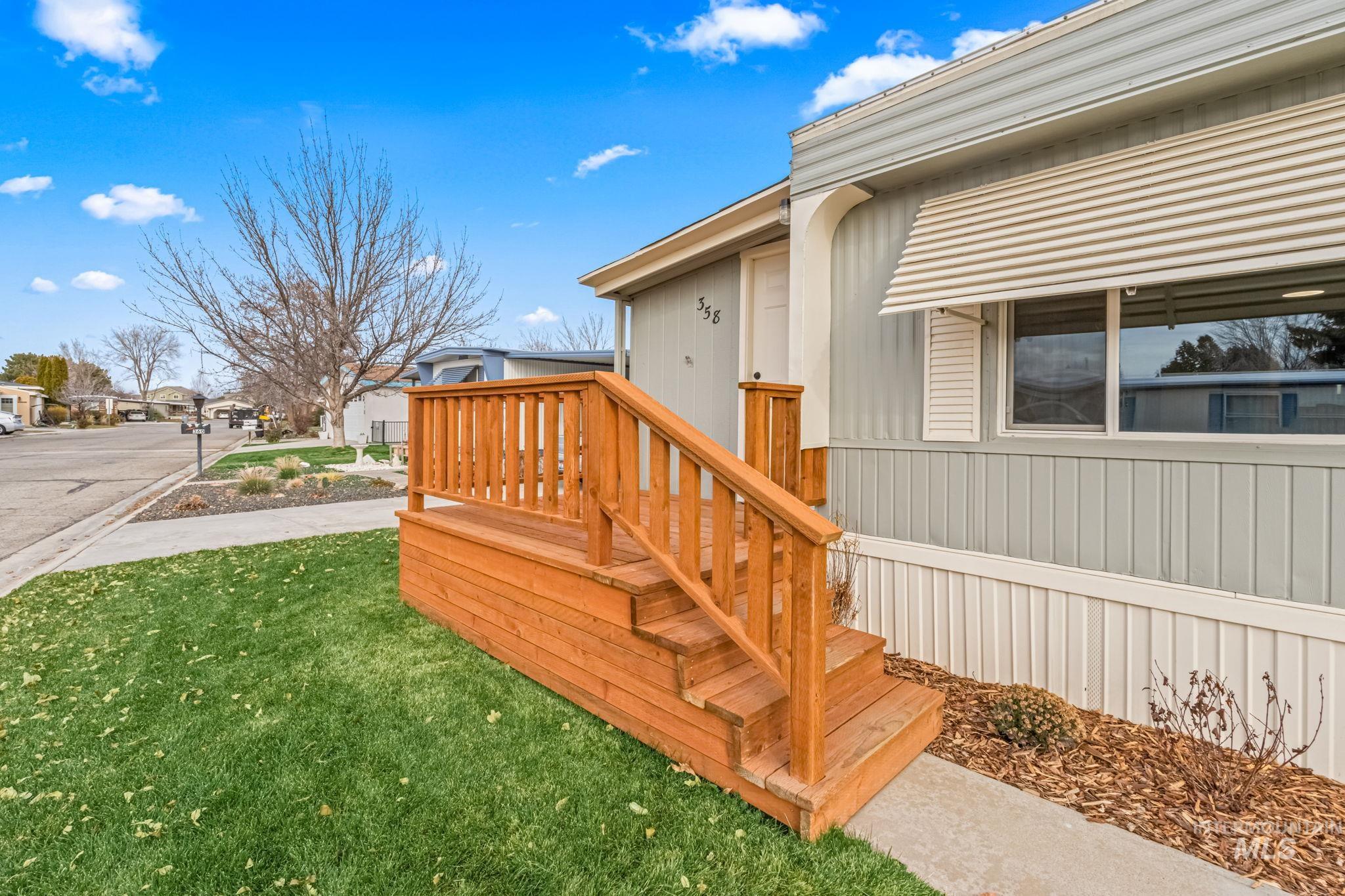 358 Bonanza Street Boise, ID 83713 - Photo 4 of 25 Doorway to property featuring a yard and a residential view
