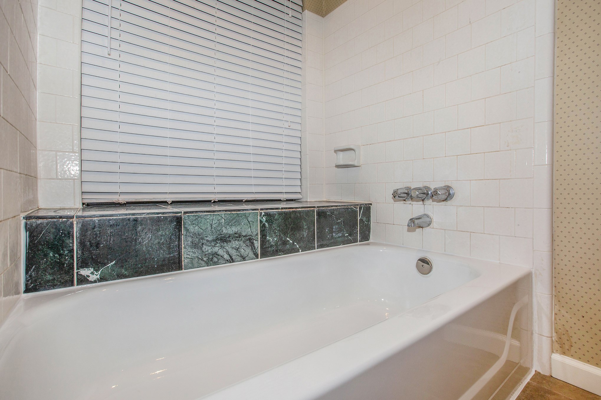 17002 Sky Blue Place Houston, TX 77095 - Photo 10 of 16 a bathroom with a bathtub and window