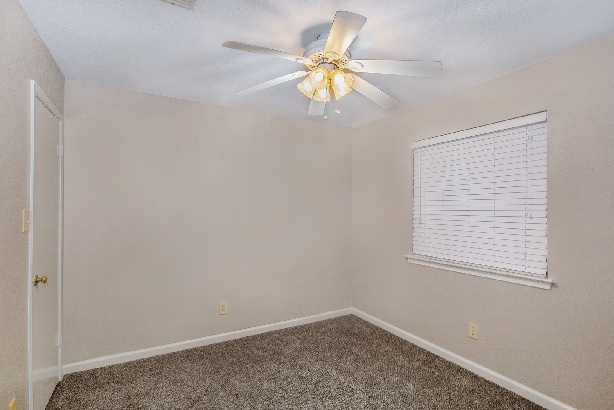 17002 Sky Blue Place Houston, TX 77095 - Photo 11 of 16 an empty room with a window and a fan