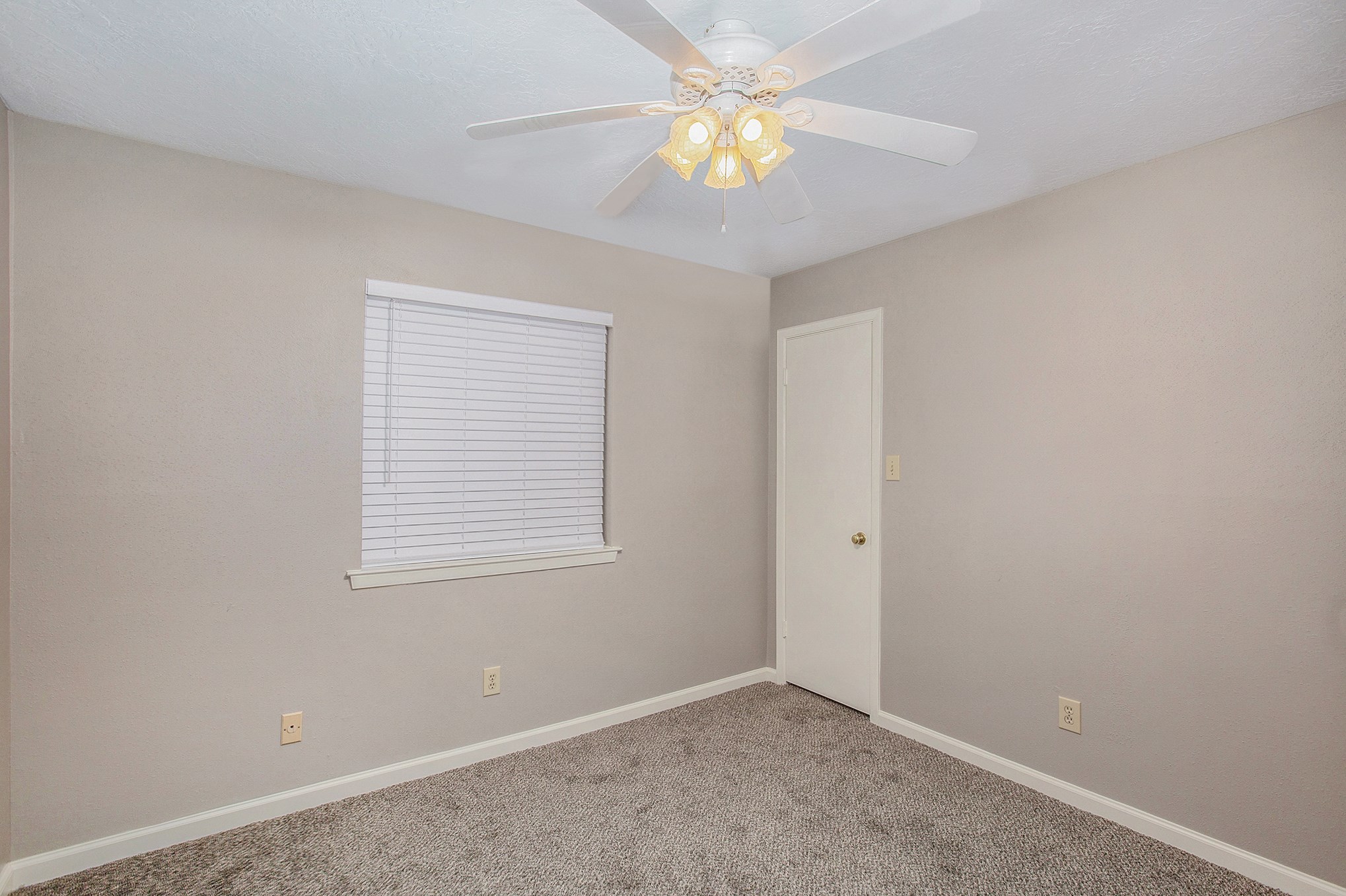 17002 Sky Blue Place Houston, TX 77095 - Photo 12 of 16 an empty room with a window and a fan