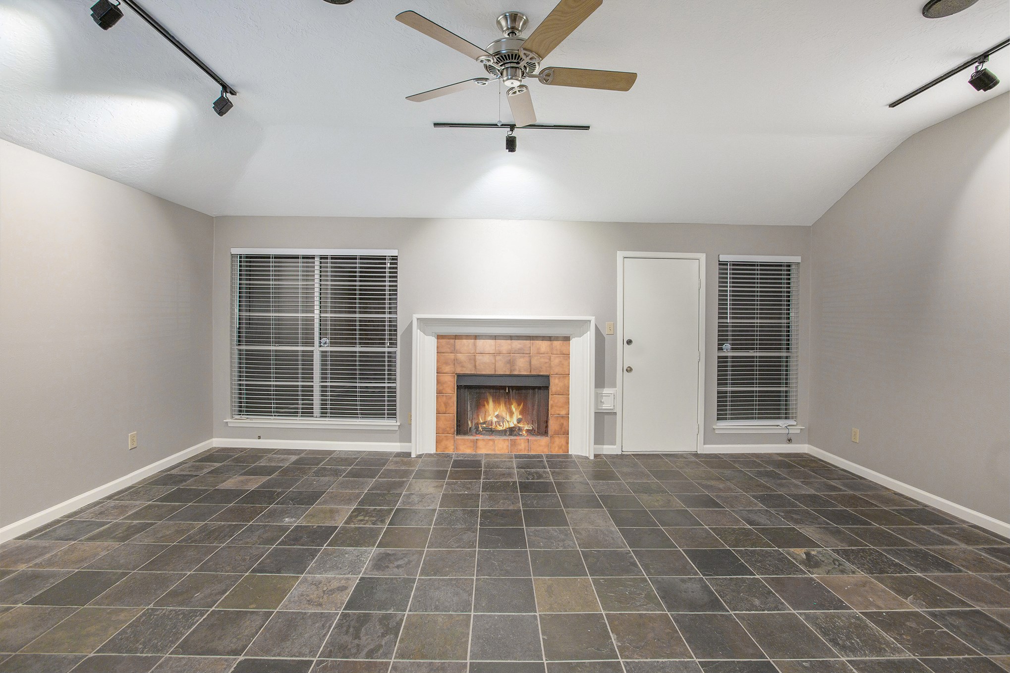 17002 Sky Blue Place Houston, TX 77095 - Photo 5 of 16 a view of an empty room with a fireplace and a window