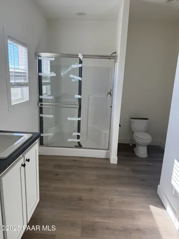 a view of an empty room and a window