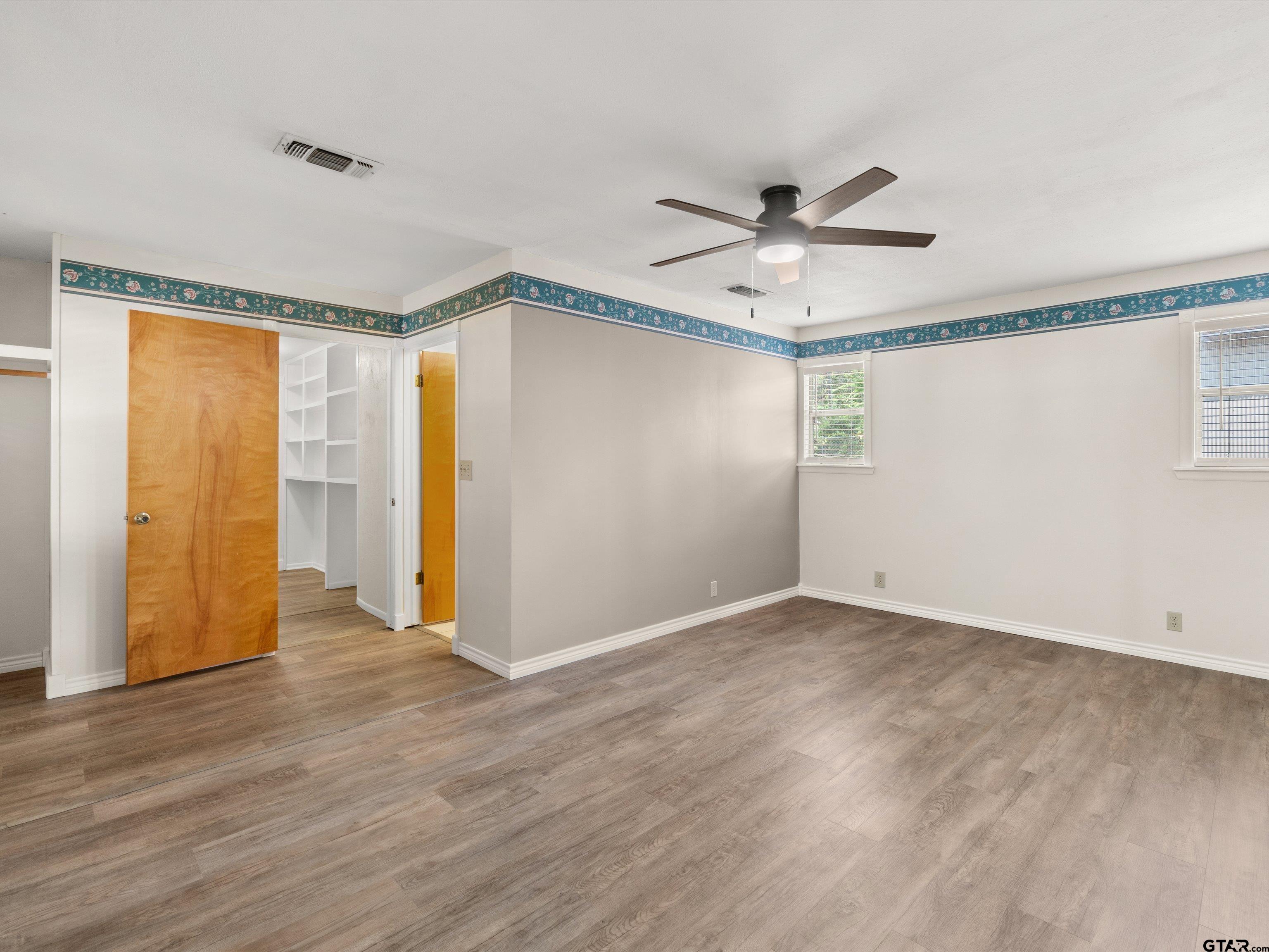 210 Gilbert Street Lone Star, TX 75668 - Photo 17 of 24 a view of an empty room with a window