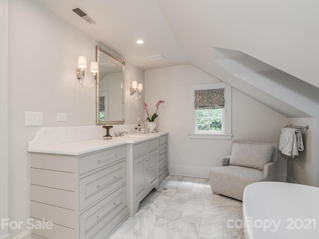 2001 Queens Road East Charlotte, NC 28207 - Photo 20 of 39 a bathroom with a sink and mirror