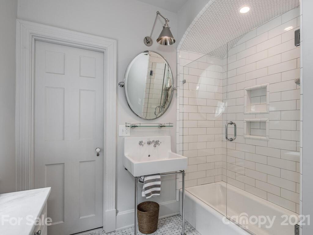 2001 Queens Road East Charlotte, NC 28207 - Photo 25 of 39 a bathroom with a sink a bathtub and a shower