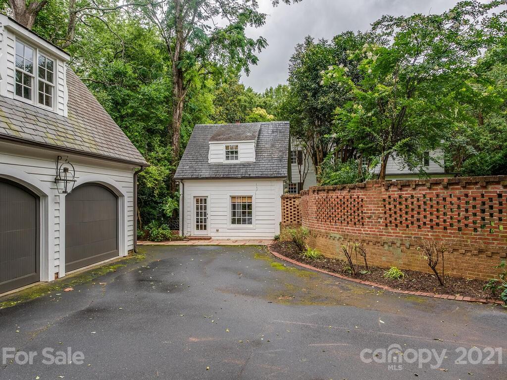 2001 Queens Road East Charlotte, NC 28207 - Photo 36 of 39 a front view of a house with a garage