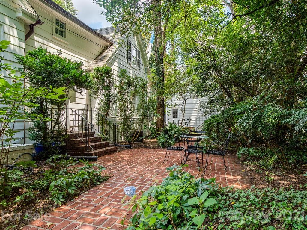 2001 Queens Road East Charlotte, NC 28207 - Photo 38 of 39 a view of a patio with table and chairs and potted plants