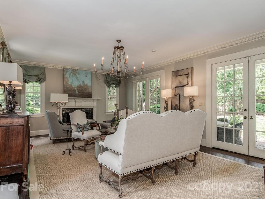 2001 Queens Road East Charlotte, NC 28207 - Photo 6 of 39 a living room with furniture and a chandelier