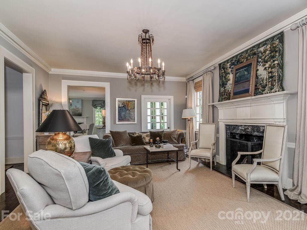 2001 Queens Road East Charlotte, NC 28207 - Photo 8 of 39 a living room with furniture and a chandelier
