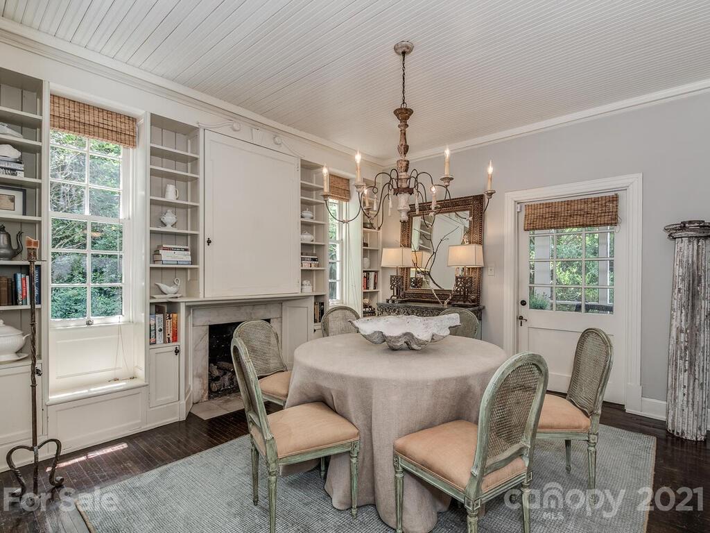 2001 Queens Road East Charlotte, NC 28207 - Photo 10 of 39 a living room with furniture and a chandelier