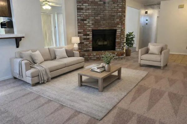 a living room with furniture and a fireplace