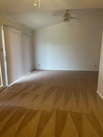 a view of an empty room with a window