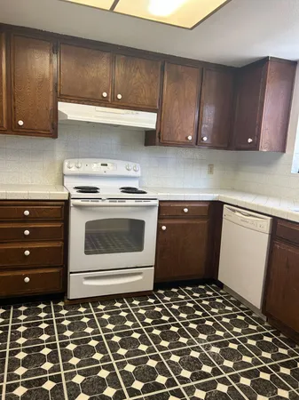 a kitchen with a sink and a stove