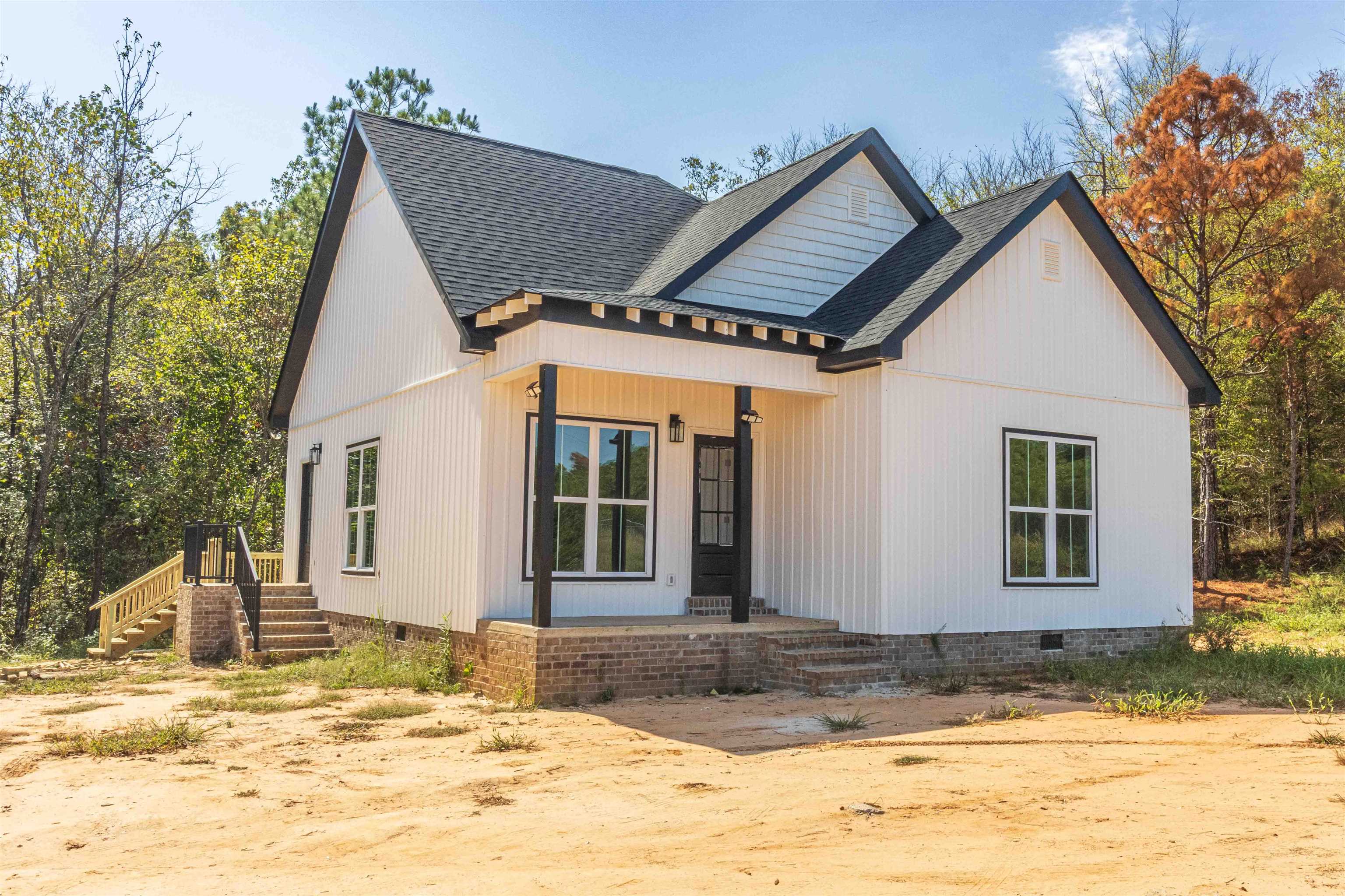a view of house with snow on the road