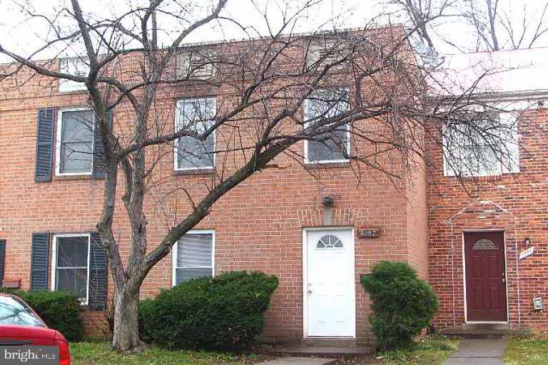9297 Taney Road Manassas, VA 20110 - Photo 1 of 9 a brick building with a large windows