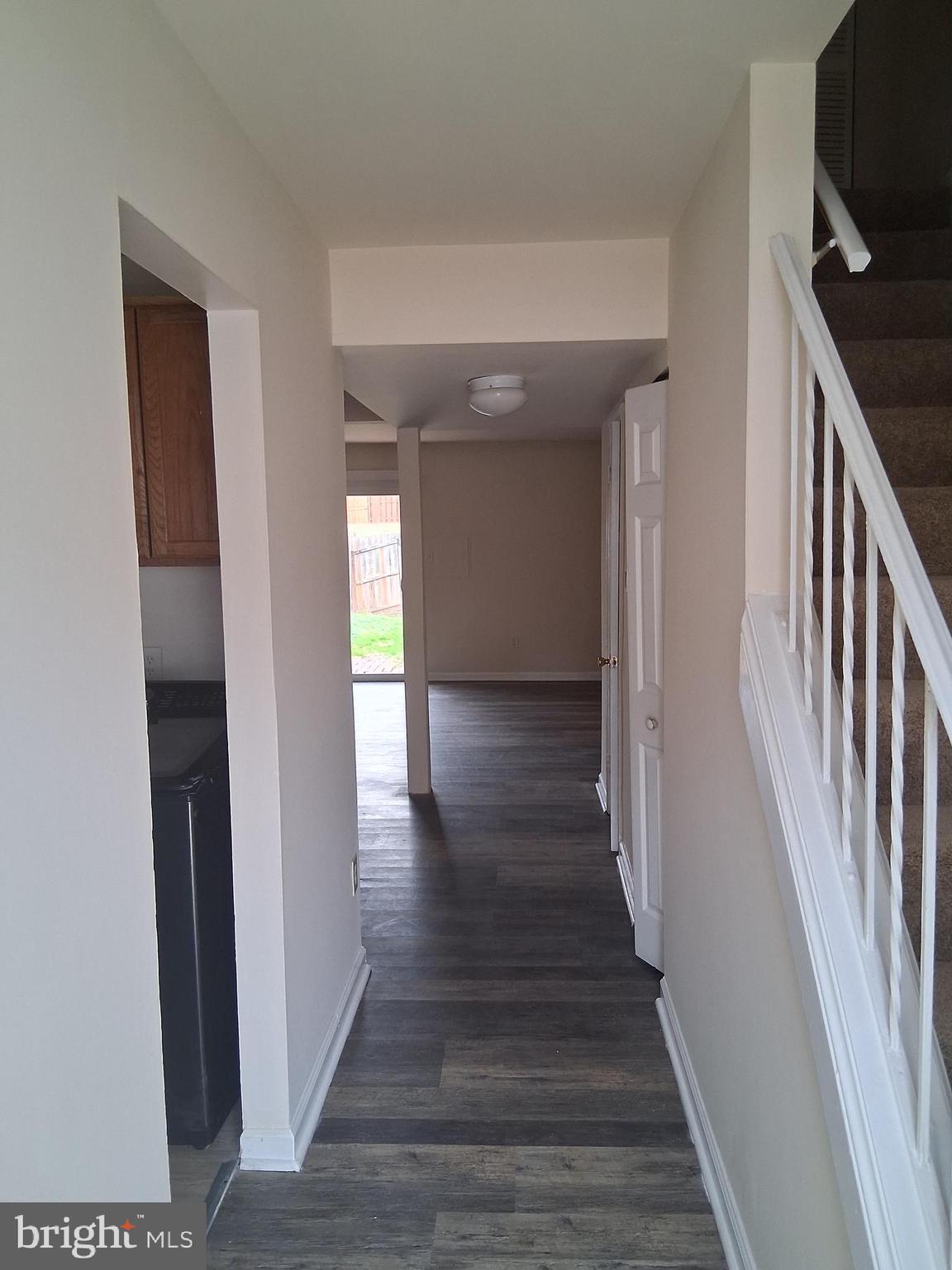9297 Taney Road Manassas, VA 20110 - Photo 2 of 9 a view of a hallway with wooden floor