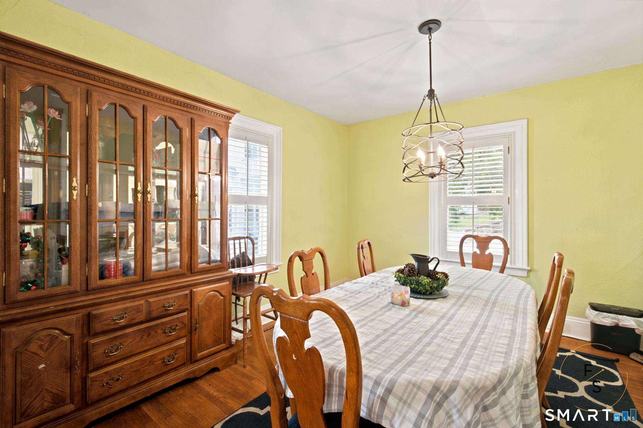 182 Broad Street Norwich, CT 06360 - Photo 8 of 30 a bedroom with a bed and a chandelier