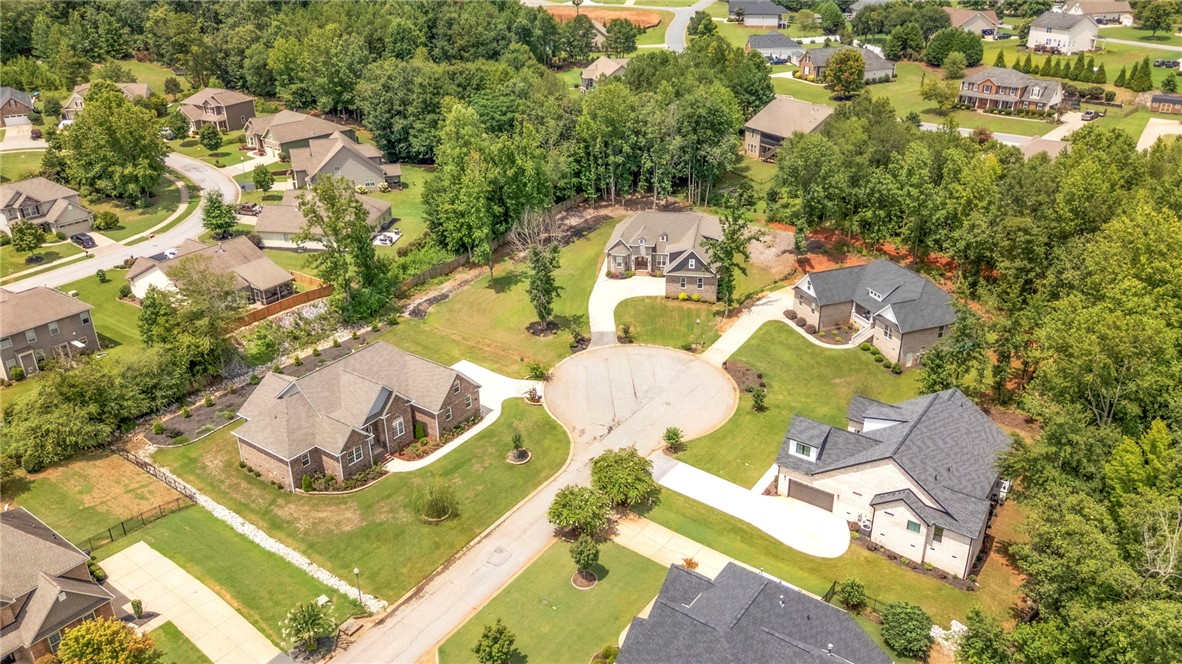 1015 Winmar Drive Anderson, SC 29621 - Photo 43 of 49 This bird's-eye view captures a vibrant neighborhood with homes nestled amidst lush greenery and mature trees.